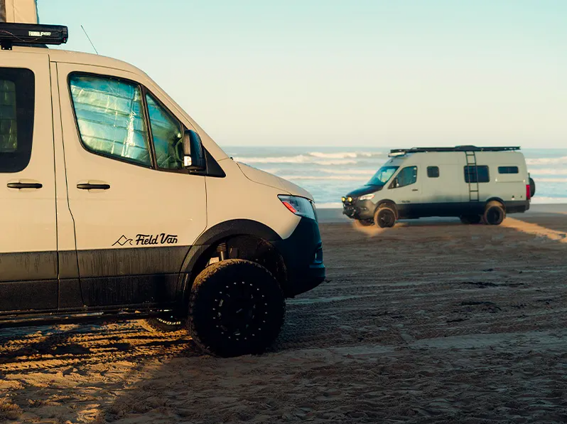 field-van-parked-on-beach