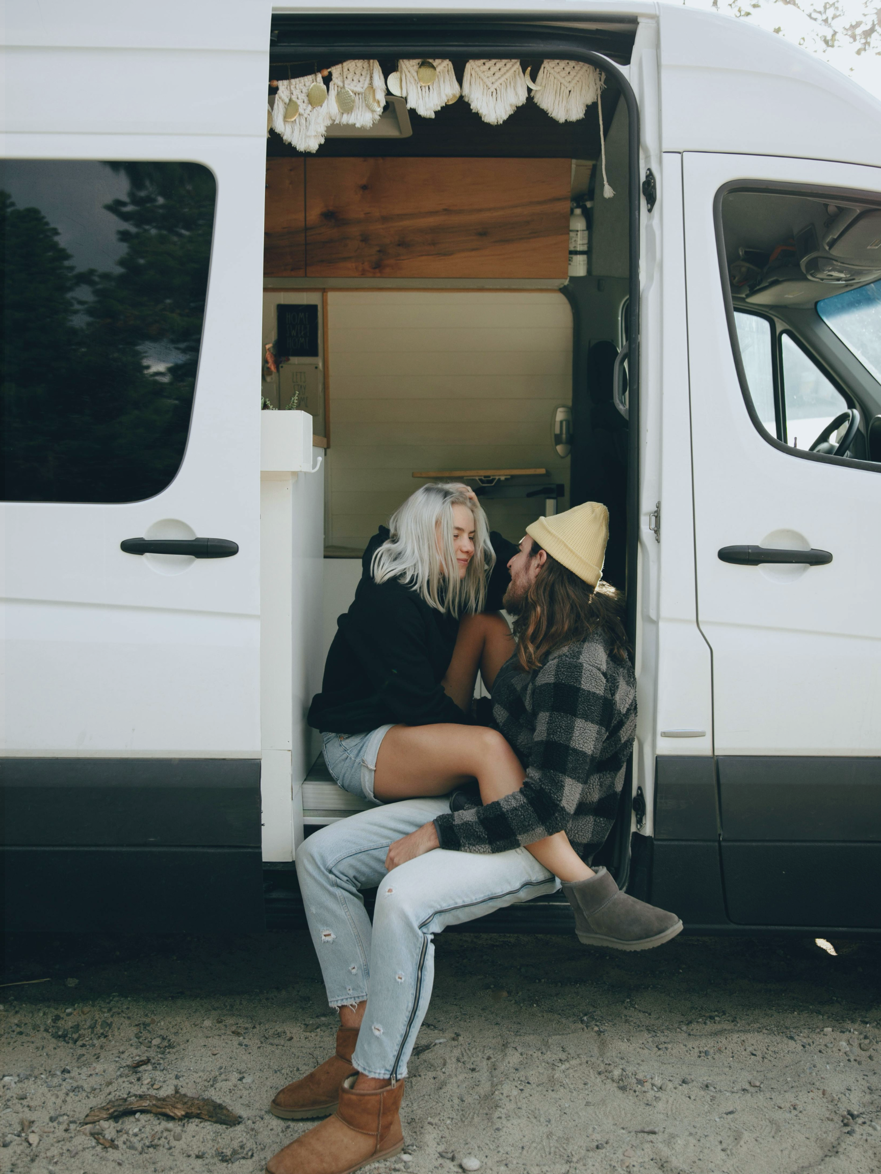 van life couple in sliding door of van