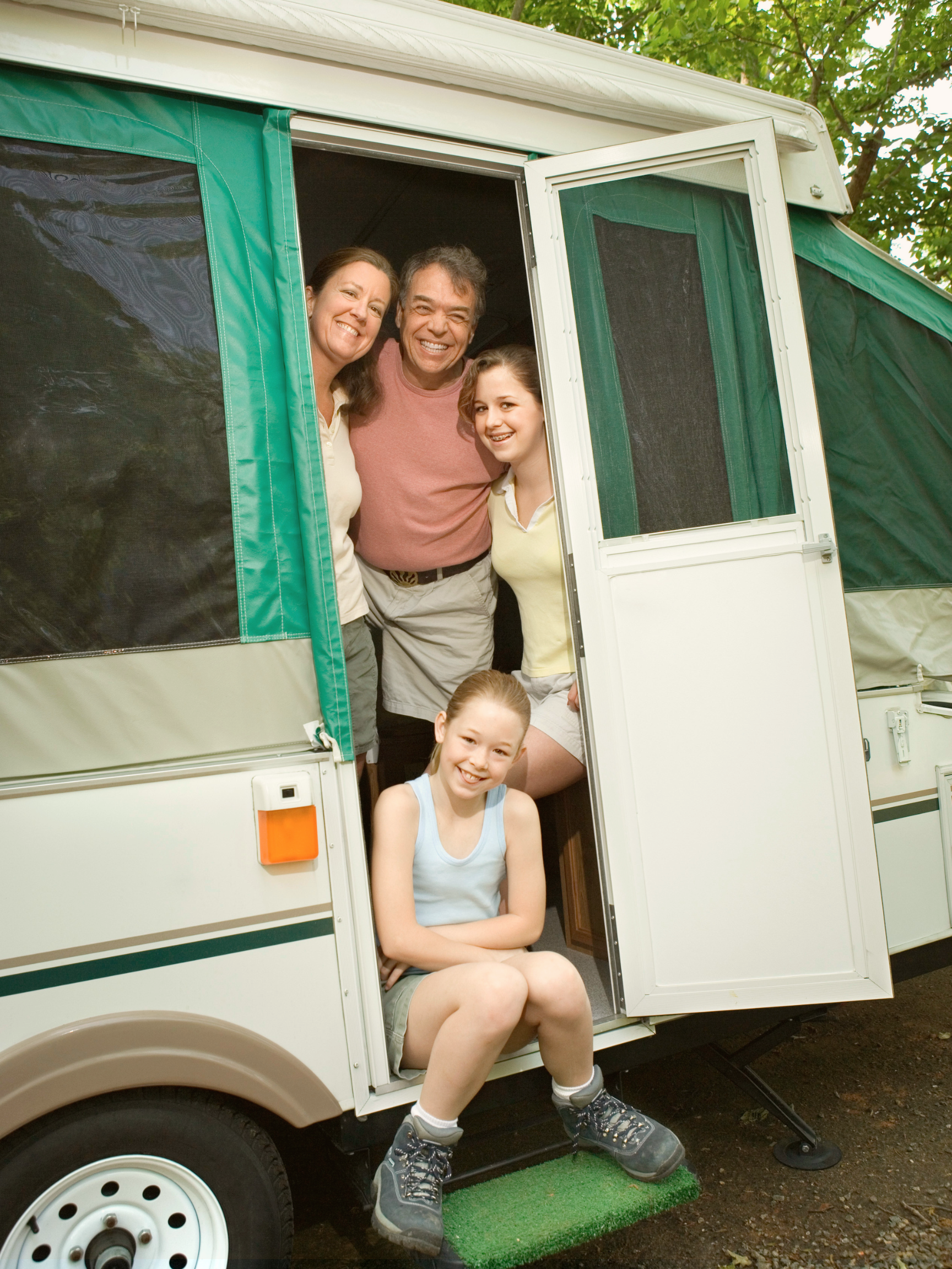 family camping in tent trailer pop up