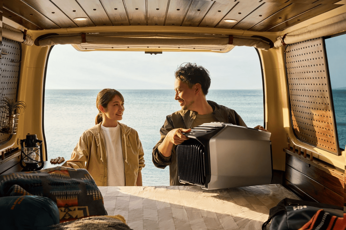 couple using portable camper van air conditioner