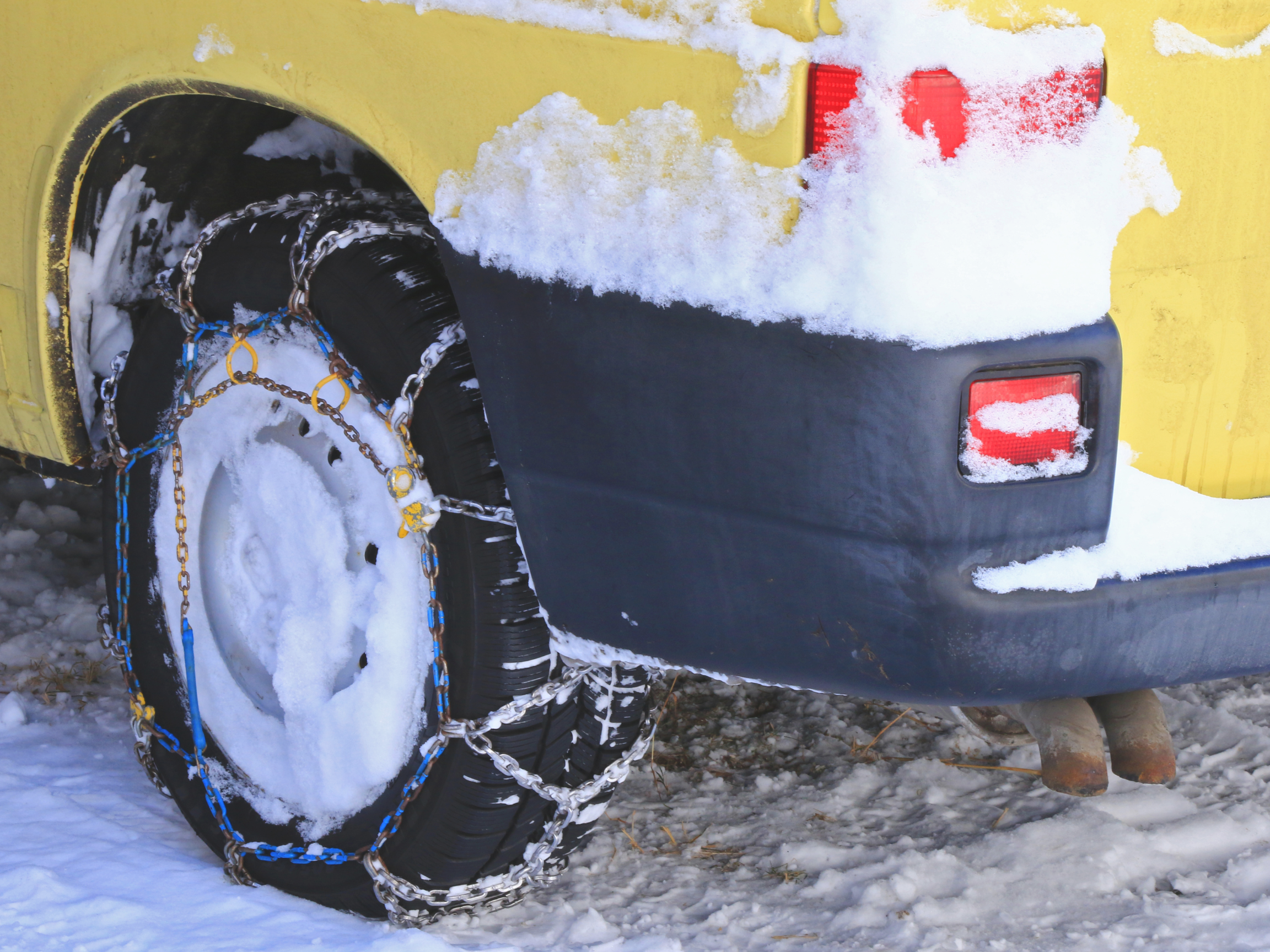 Snow chain tires recovery gear on van