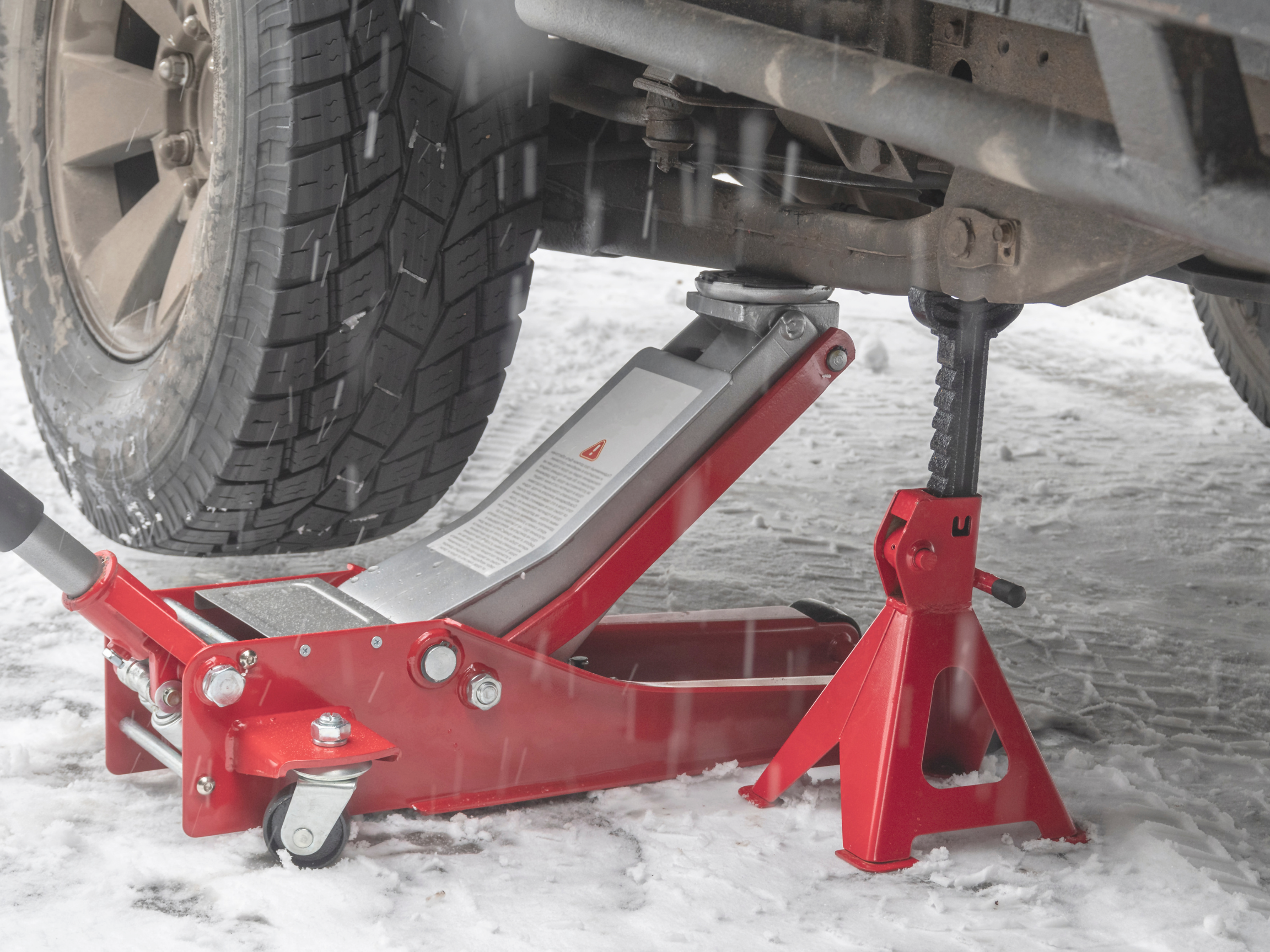 Car jack recovery gear in snow