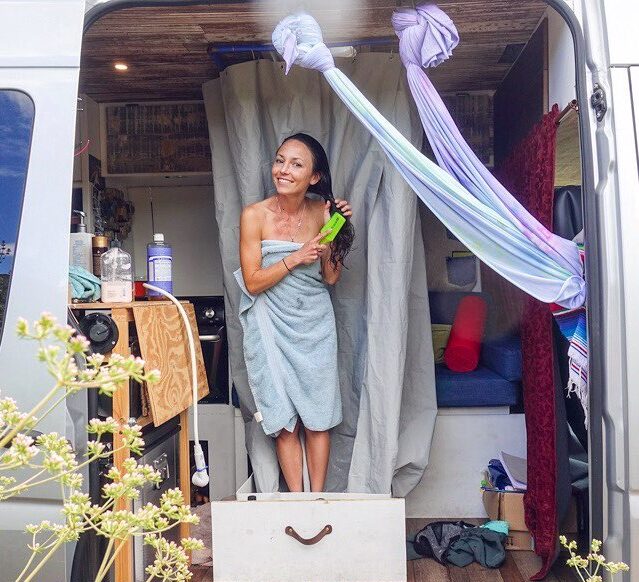 Person in van life after a shower