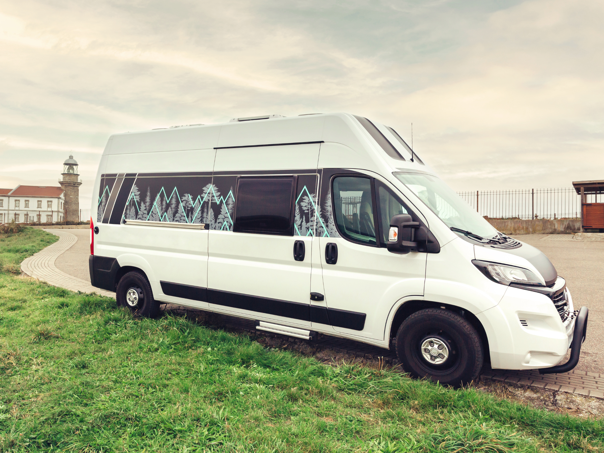 Van next to a lighthouse