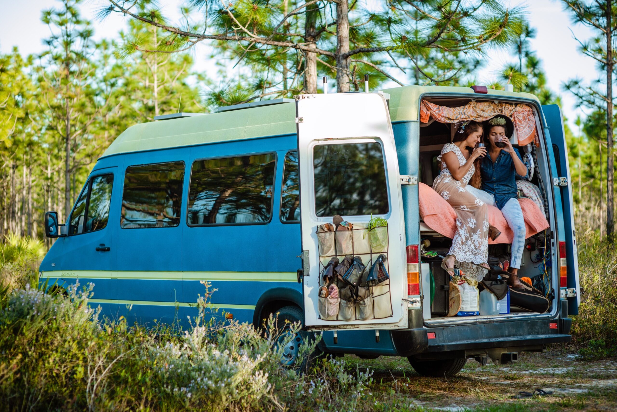 Couple on honeymoon sitting in campervan