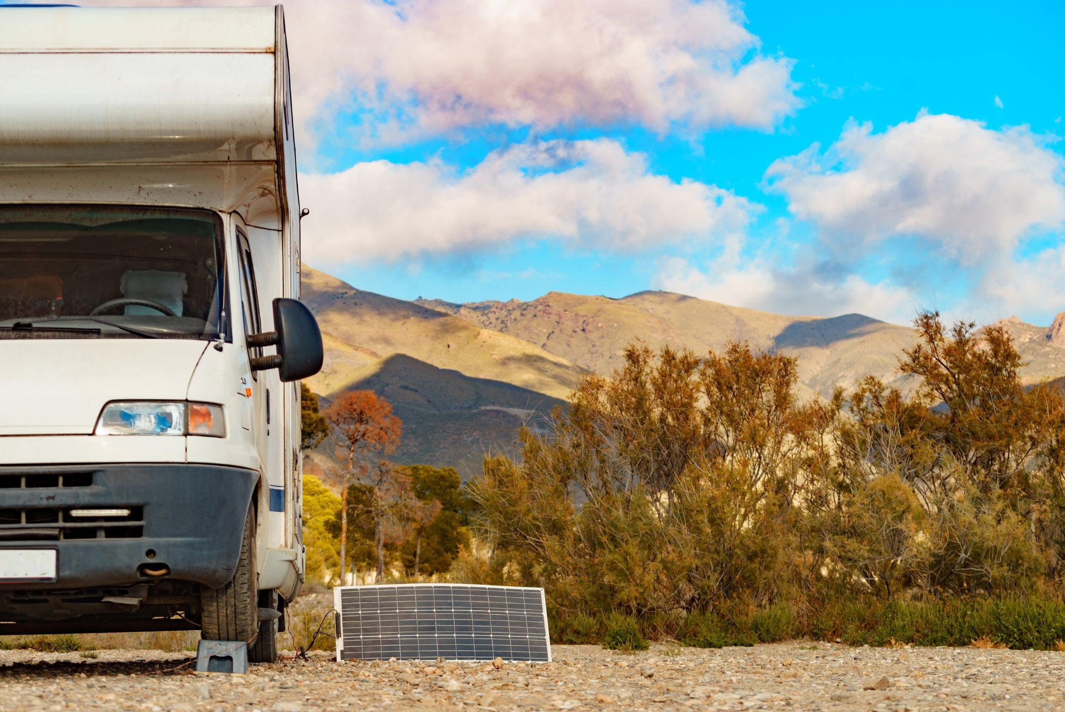 Portable solar panel next to camper