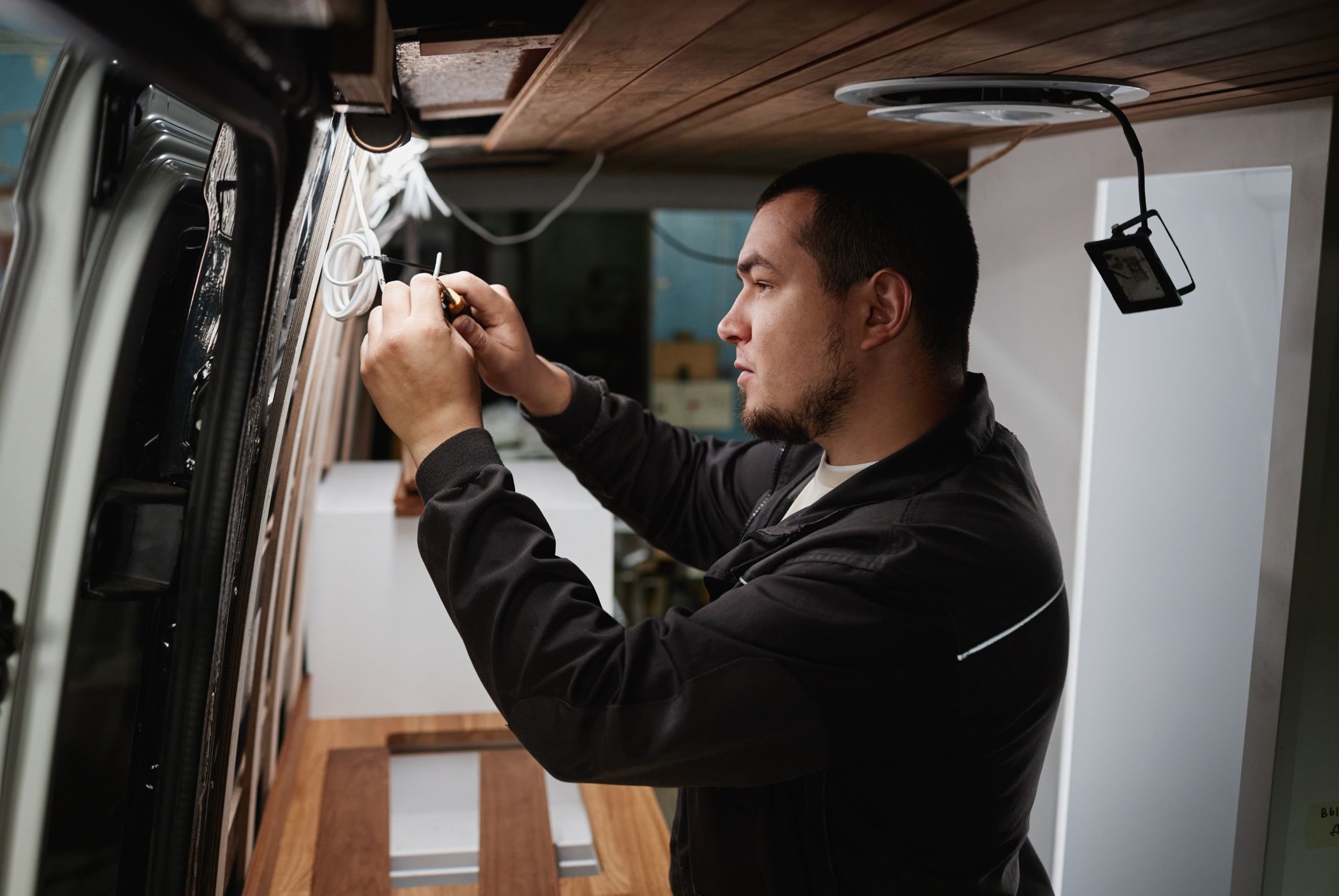 Person wiring a camper power system