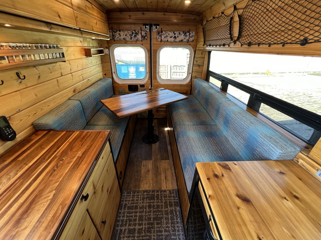 Campervan dinette with custom mattress cushions